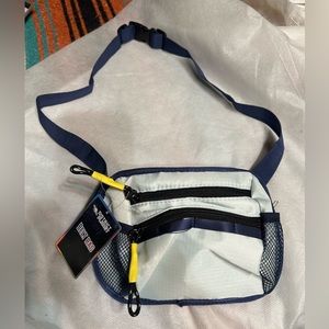 Navy Belt Bag. 2 zipper pockets, 2 side mesh pockets and loops. New with tags